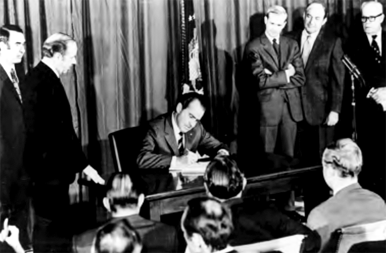 Richard Nixon signs the OSH act