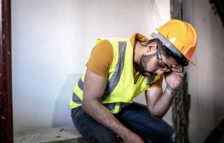 Fatigued construction worker