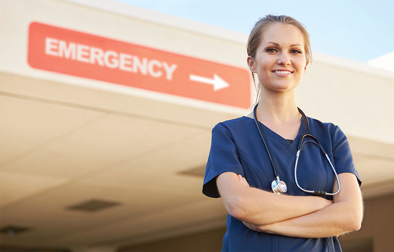 nurse standing outside emergency room