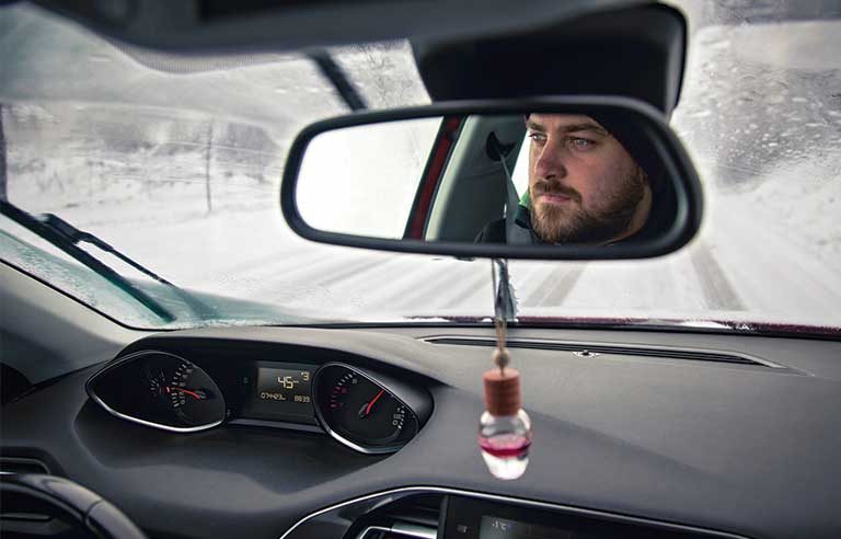 man driving snowy condition