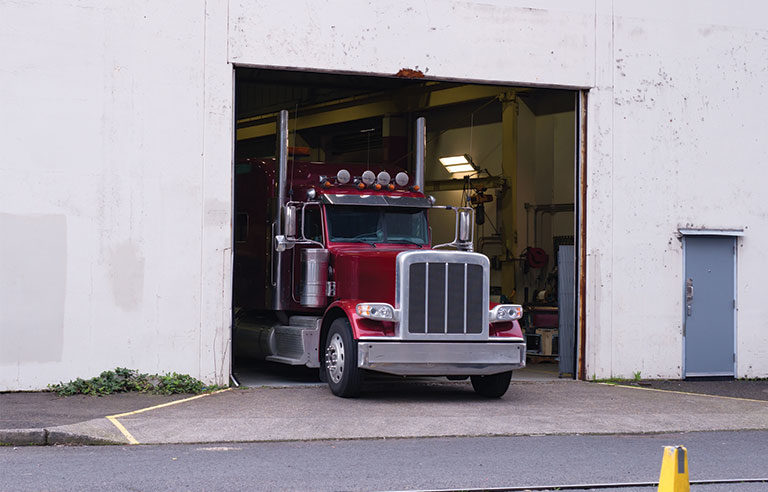 red semi truck warehouse