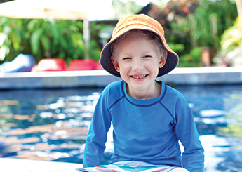 boy by the pool