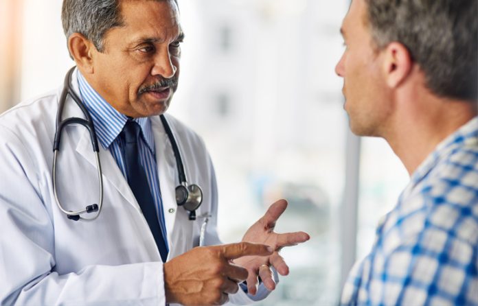 Doctor with male patient