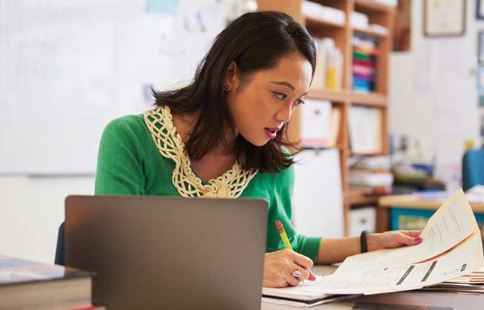 female-teacher-sitting