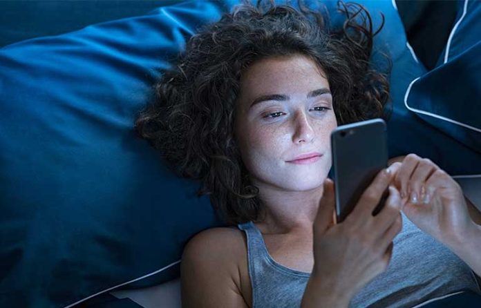 in-bed-with-cellphone.jpg