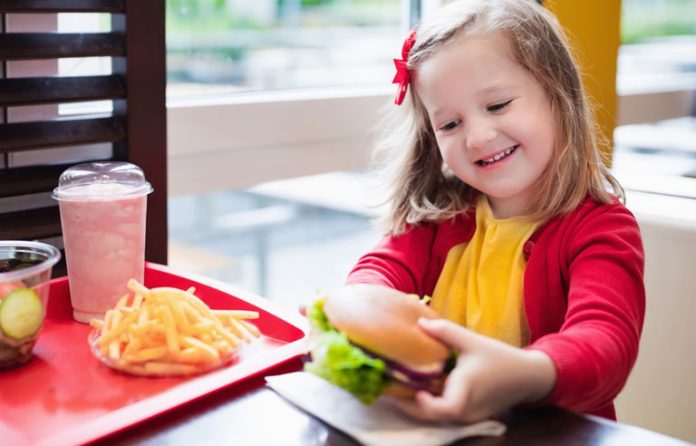 Girl eating fast food