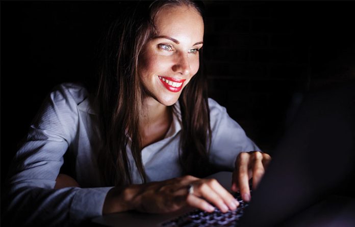 laptop working in the dark