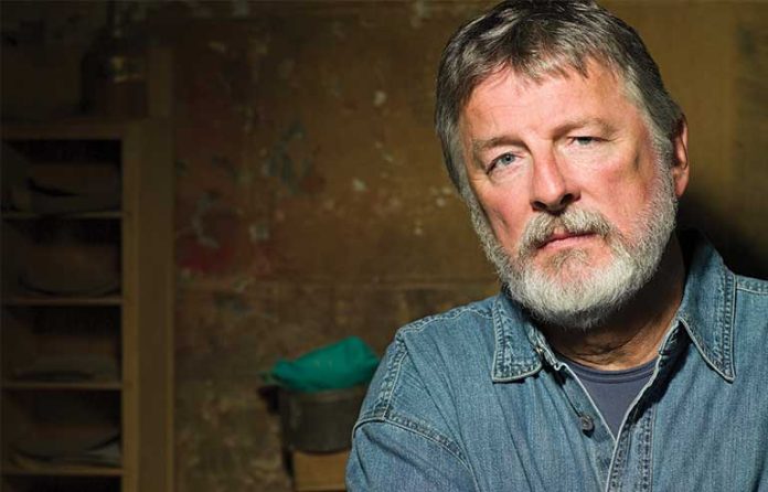 man in denim shirt