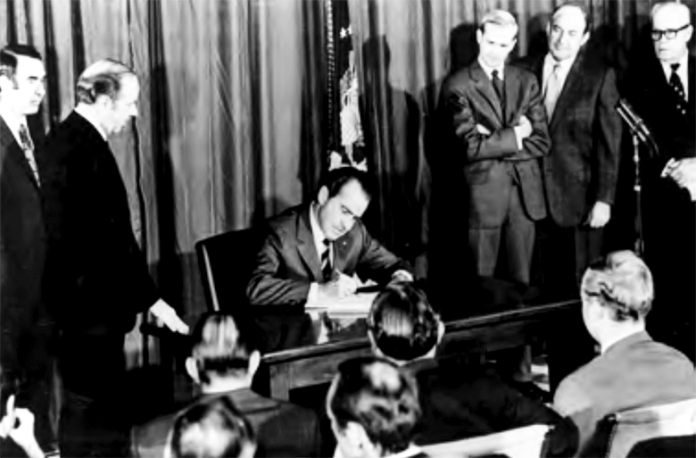 Richard Nixon signs the OSH act