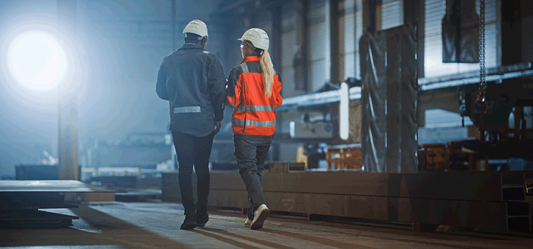 Workers walk
