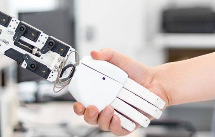 robot and human handshake