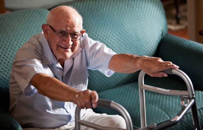 senior man sitting on couch