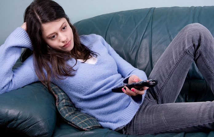 Teen girl watching TV