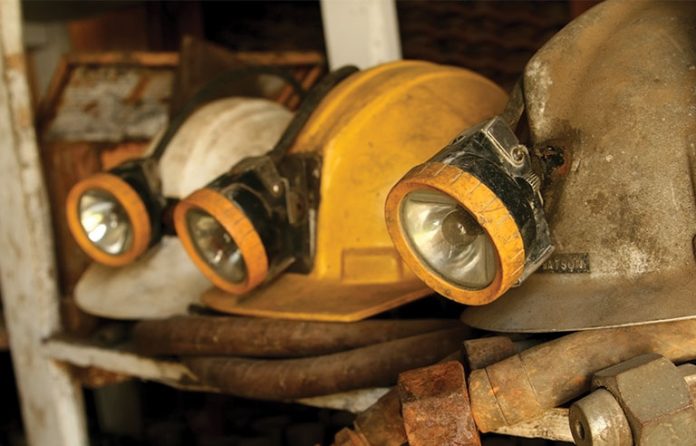 three mining helmets