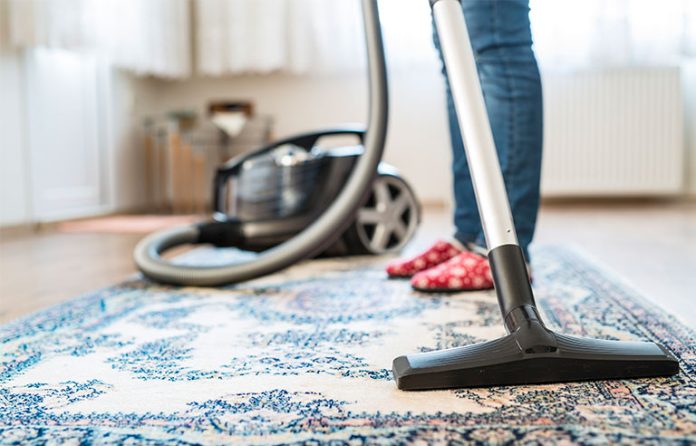 vacuuming a room