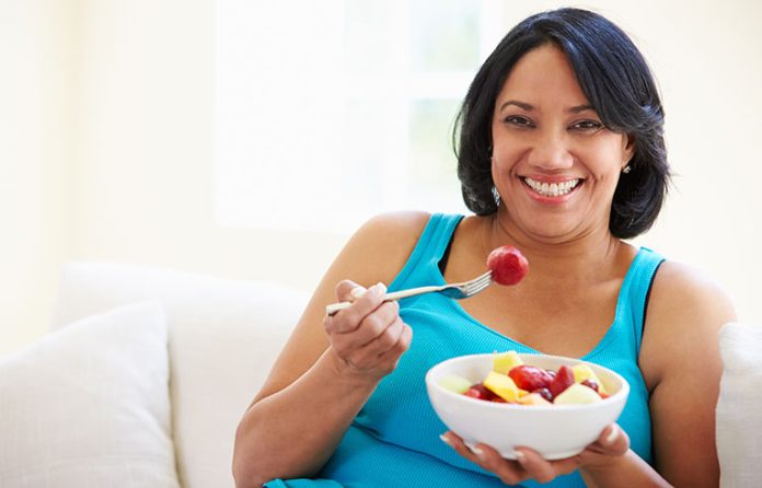 woman eating fruit