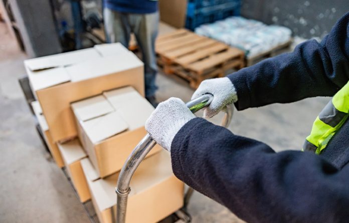 worker-pushing-cart.jpg