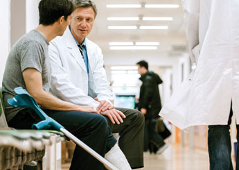 Doctor speaking with injured person