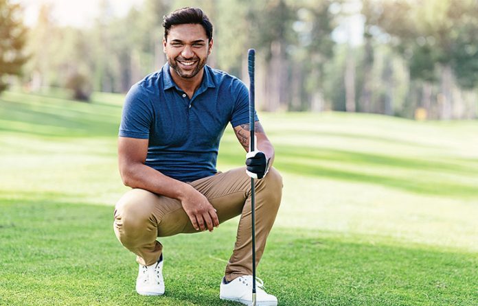 Indian man golfing