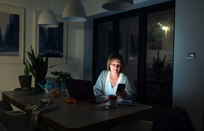 Woman at home desk late at night