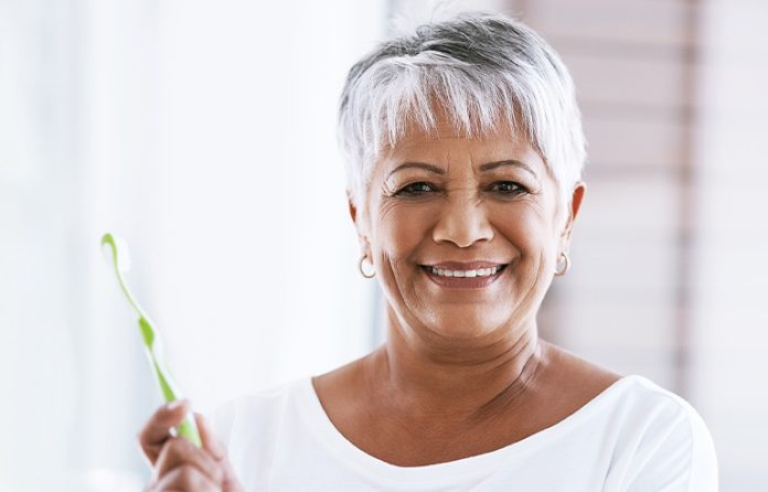 Senior older adult woman with toothbrush